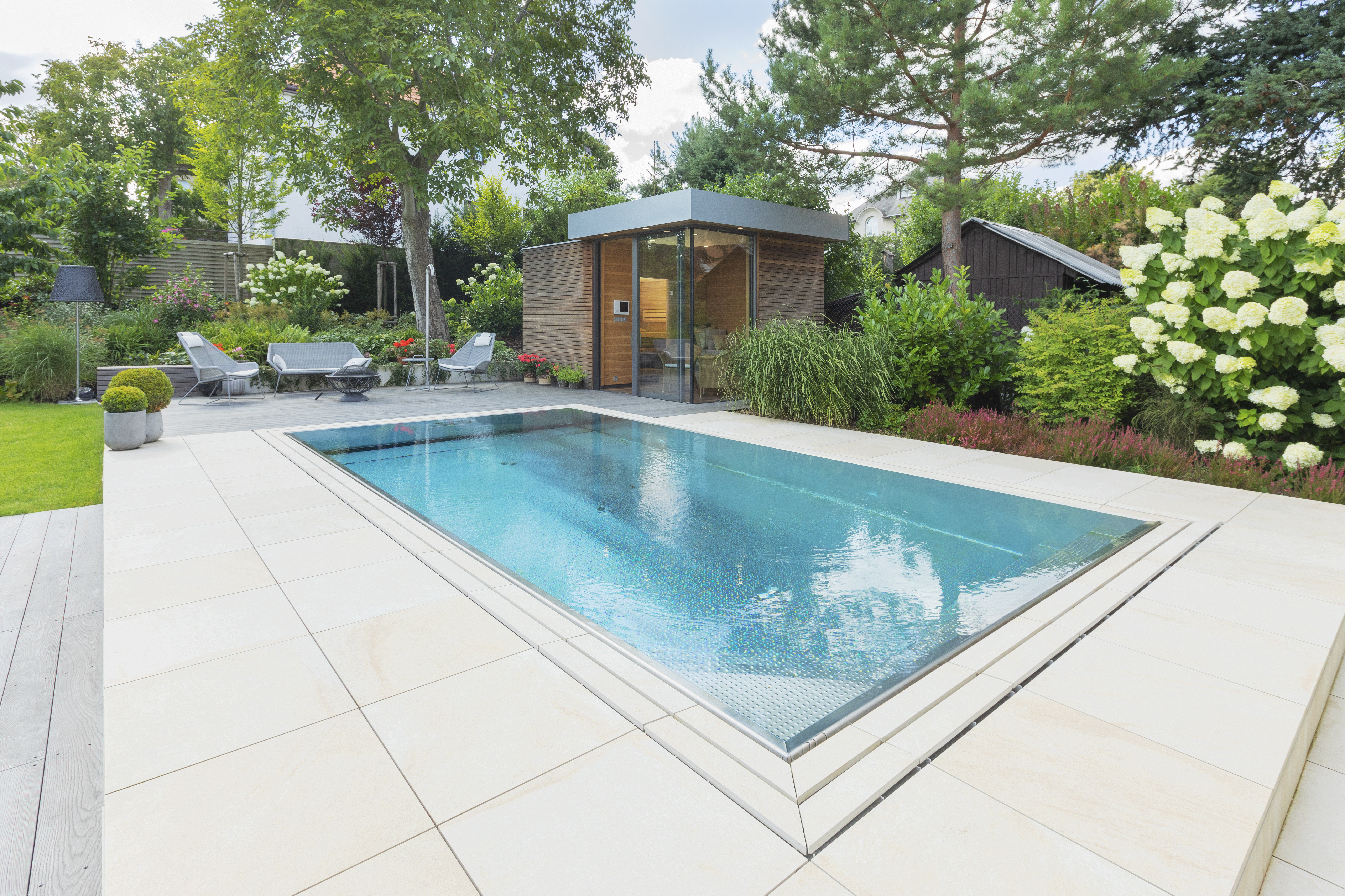 Stainless steel pool IMAGINOX with outdoor sauna